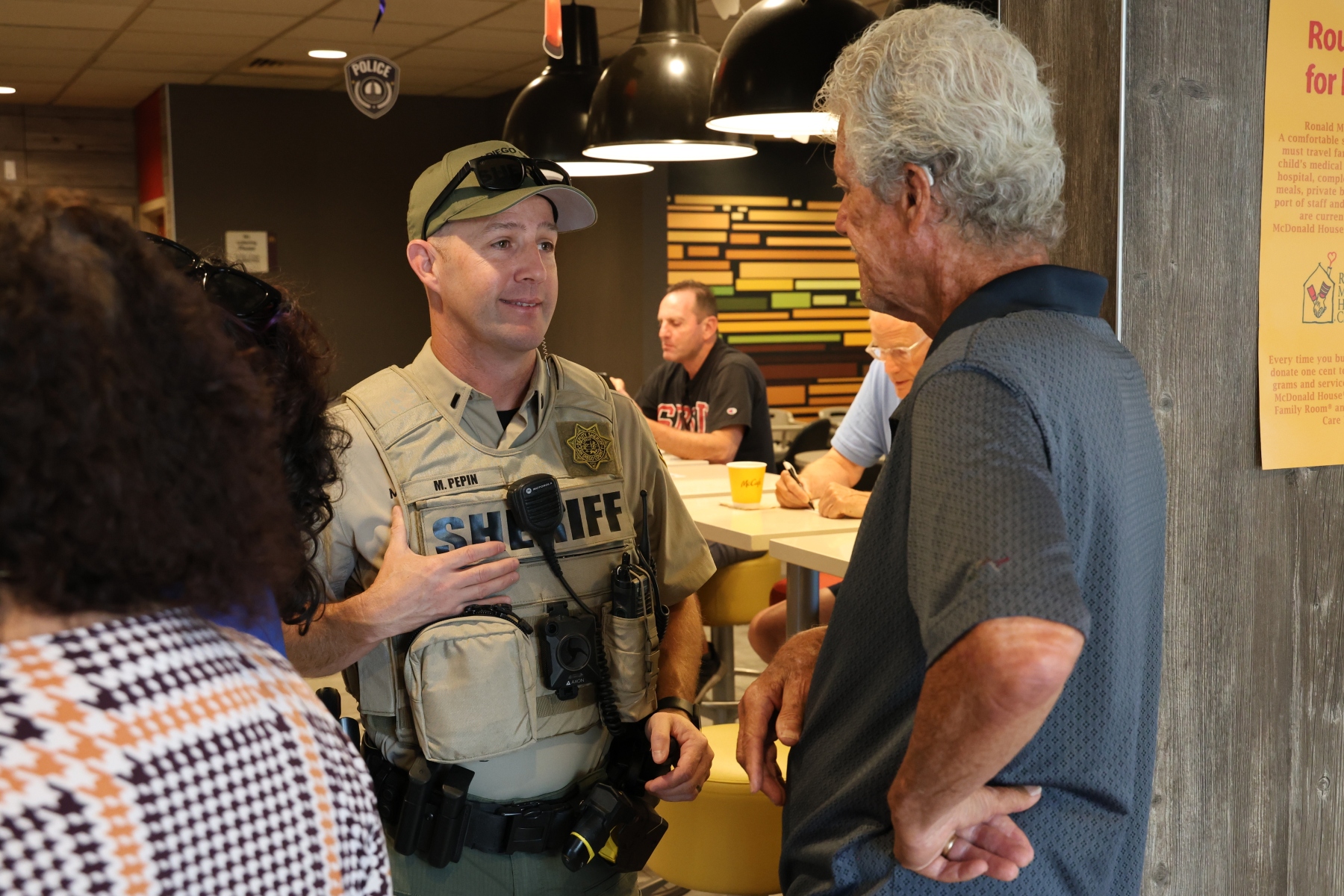 Sheriff's Office representatives discussing Safe Spring Valley program